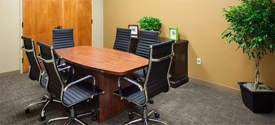 Small conference room with seating for six