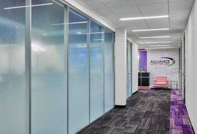 Branded wall at the end of the hallway