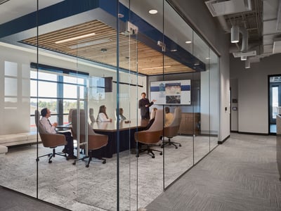 Beautiful boardroom closed off by glass doors and walls