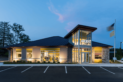 The credit union branch lit up at night