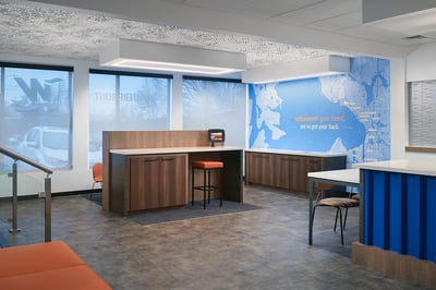 iPad station and branded mural in a credit union