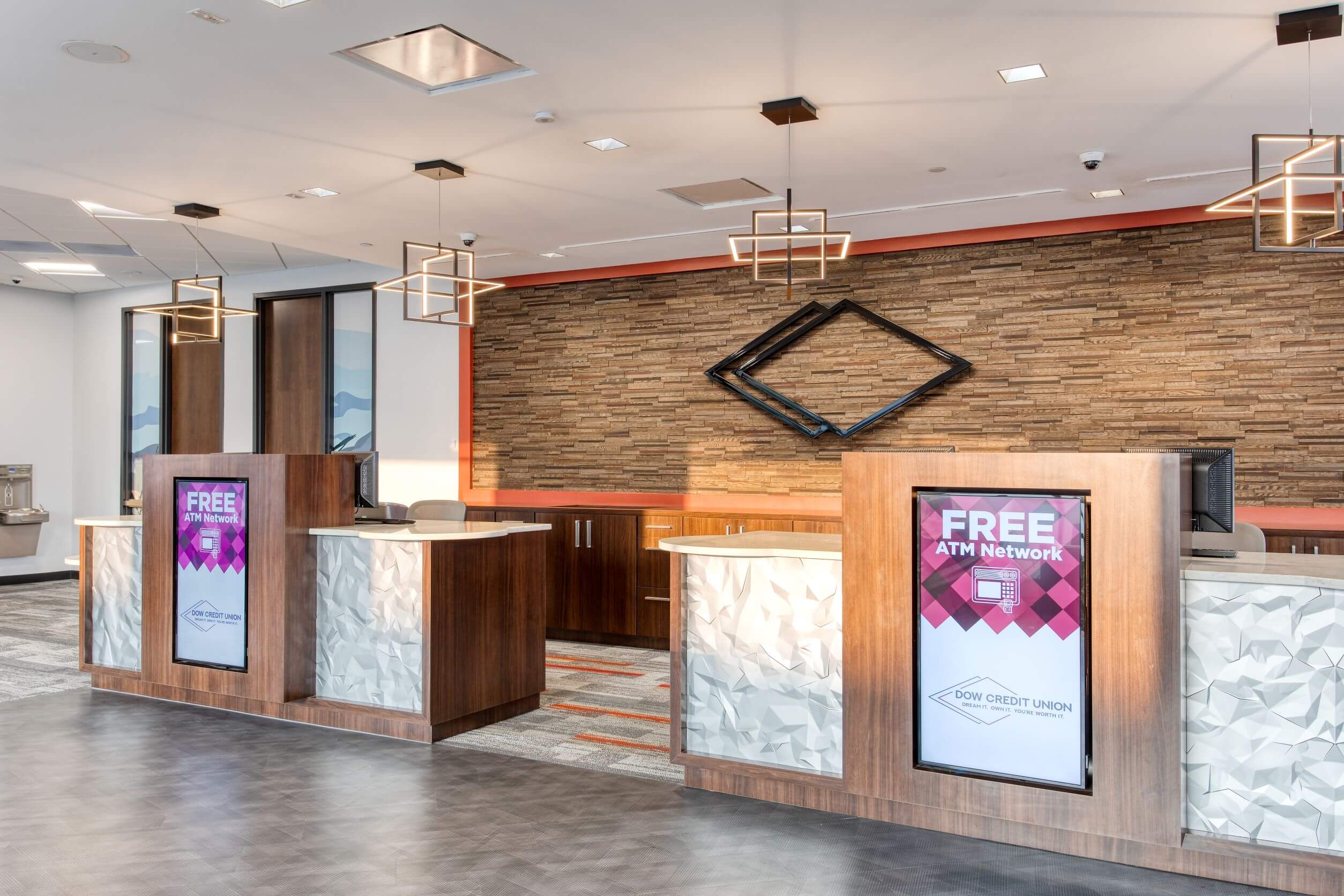 Branded digital displays that are built into the teller pods