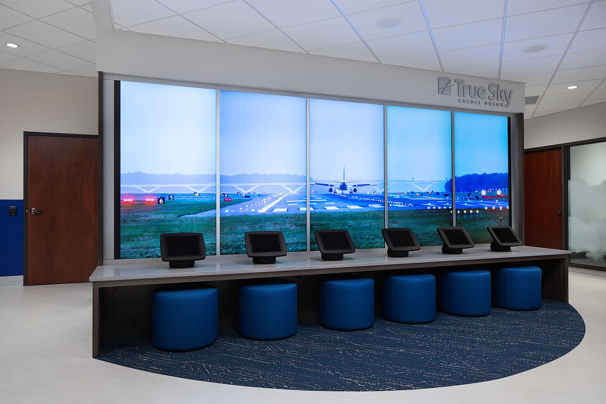 Five LED monitor displays in a credit union